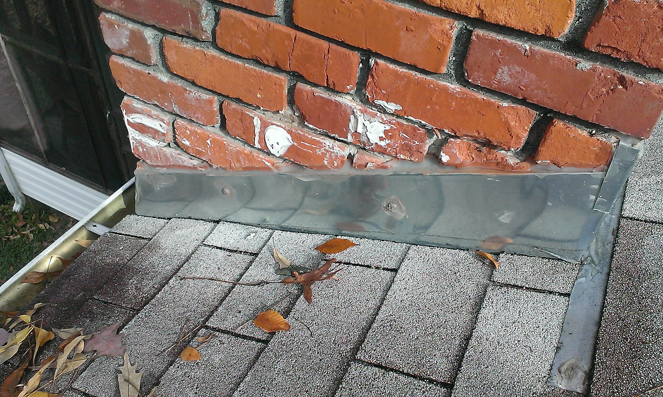 Worker Repairing A Roof